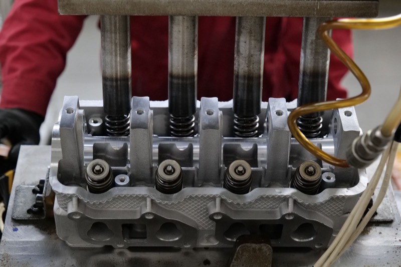 Cylinder head with fuel injectors installed.